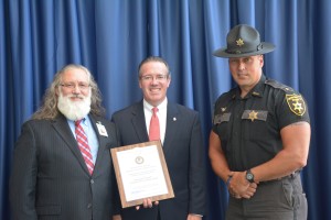 County Sheriff Shambaugh and McDaniel receiving an award for Handle with Care from then-State's Attorney Booth Goodwin